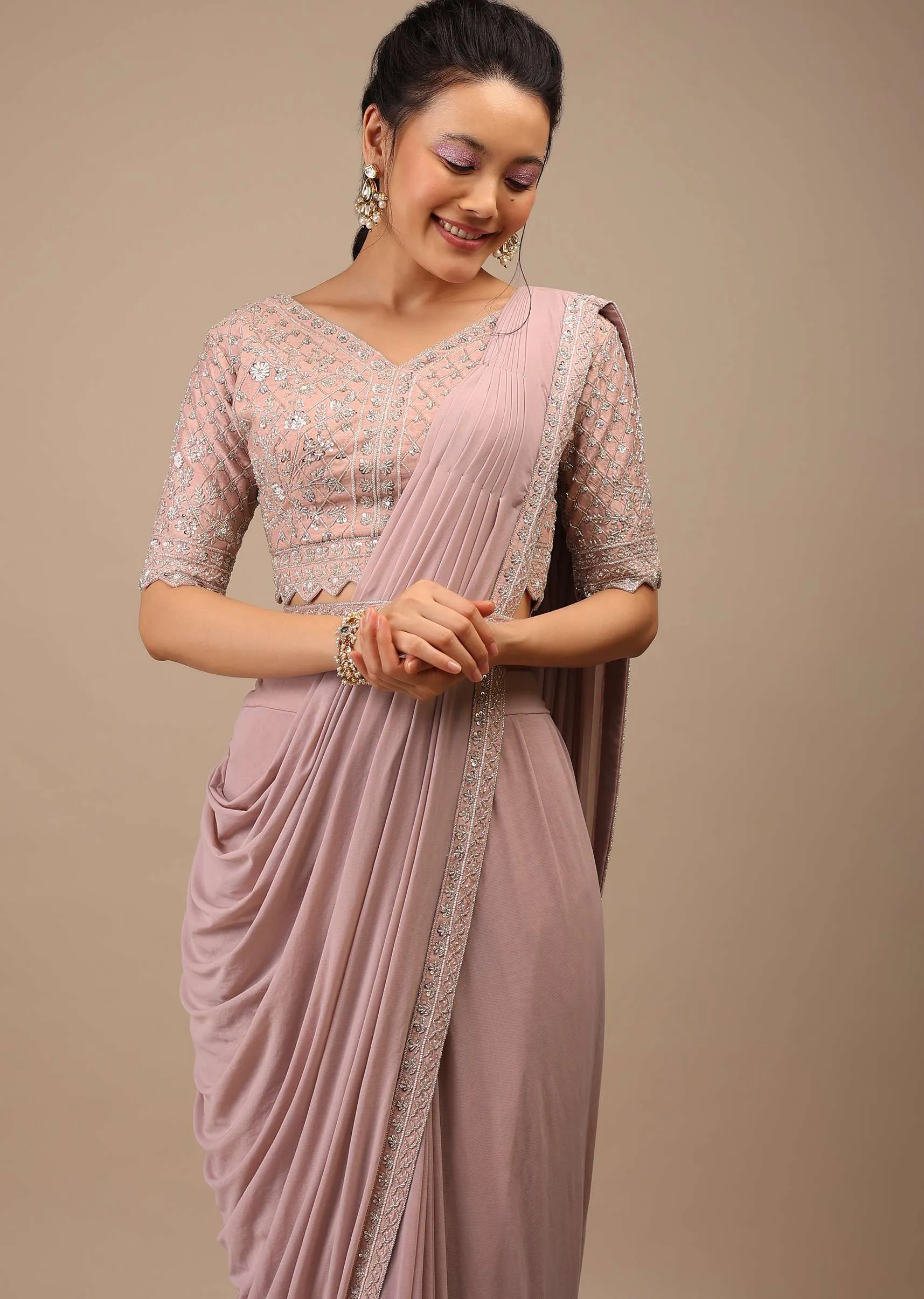 Misty Rose Pleated Saree In Lycra Blend Detailed With Embroidery Work On Pallu Border And Moroccan Jaal